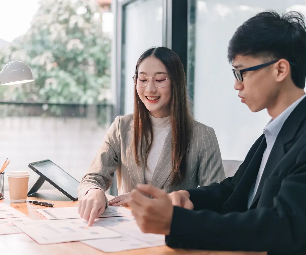 two people-looking-at-documents